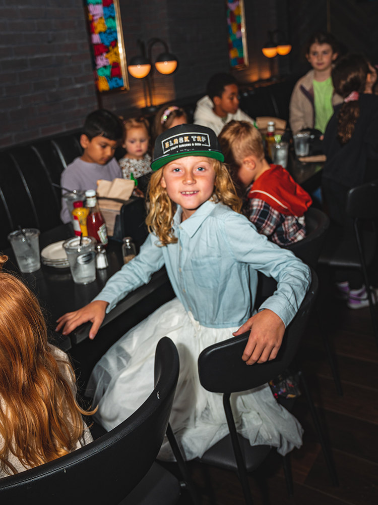 Birthday party guests enjoying event